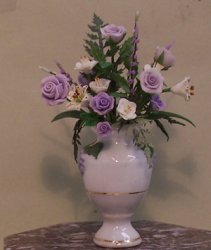 Purple Roses in White China Vase